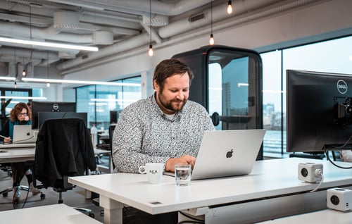 Picture of colleague working in our open space at ACA Group Picture of colleague working in our open space at ACA Group