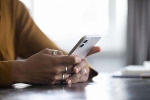 person using their mobile phone person using their mobile phone